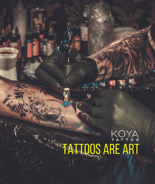 artist tattooing a client’s arm