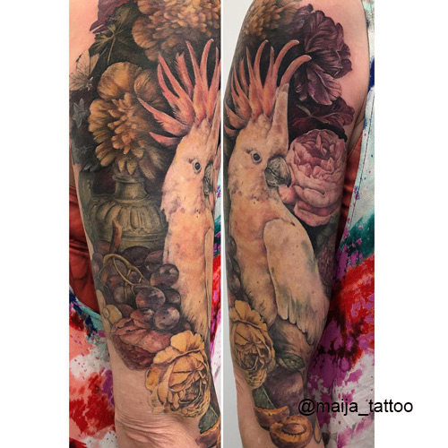 rose flower tattoo on arm