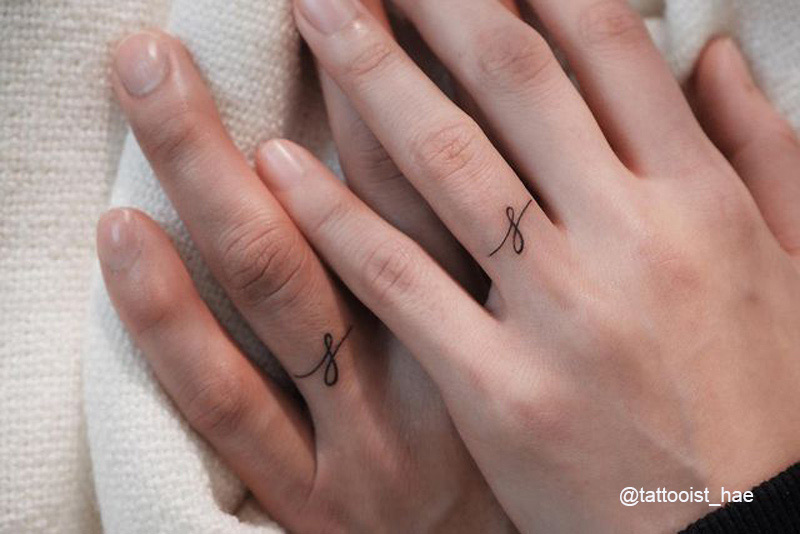 matching fingers tattoo